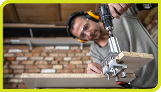 WORKER USING CARPENTRY TOOLS | SERVICES | FLORIDA KITCHEN CENTER