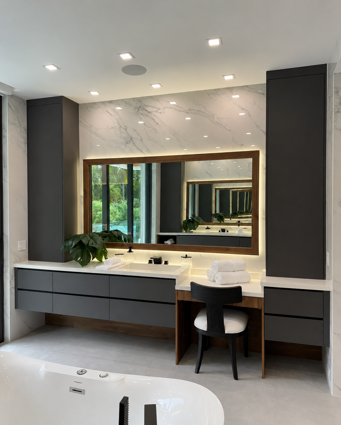 Luxury bathroom vanity suite with floating cabinets and integrated mirror lighting