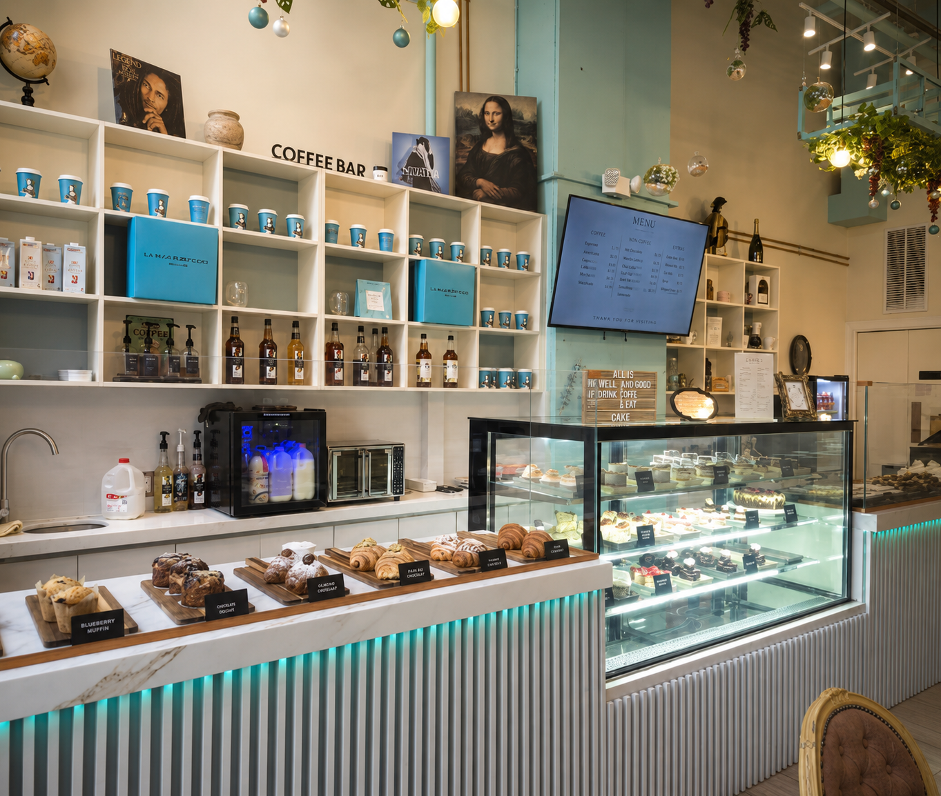 Commercial coffee bar with custom display shelving and service cabinetry