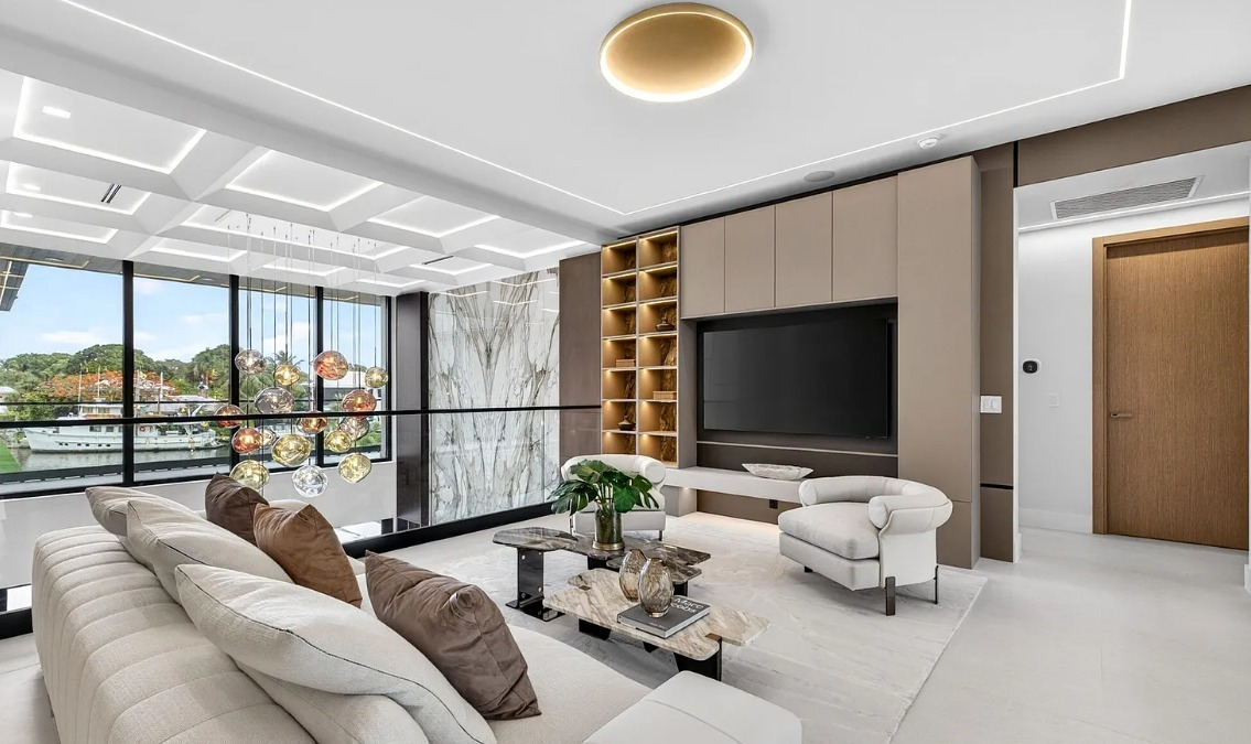 Luxury media lounge with custom built-in cabinetry and display shelving