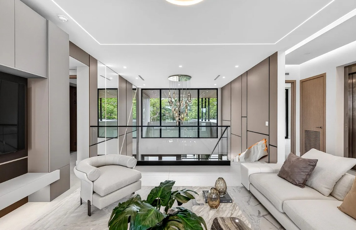 Modern living room with custom wall panels and integrated media cabinetry