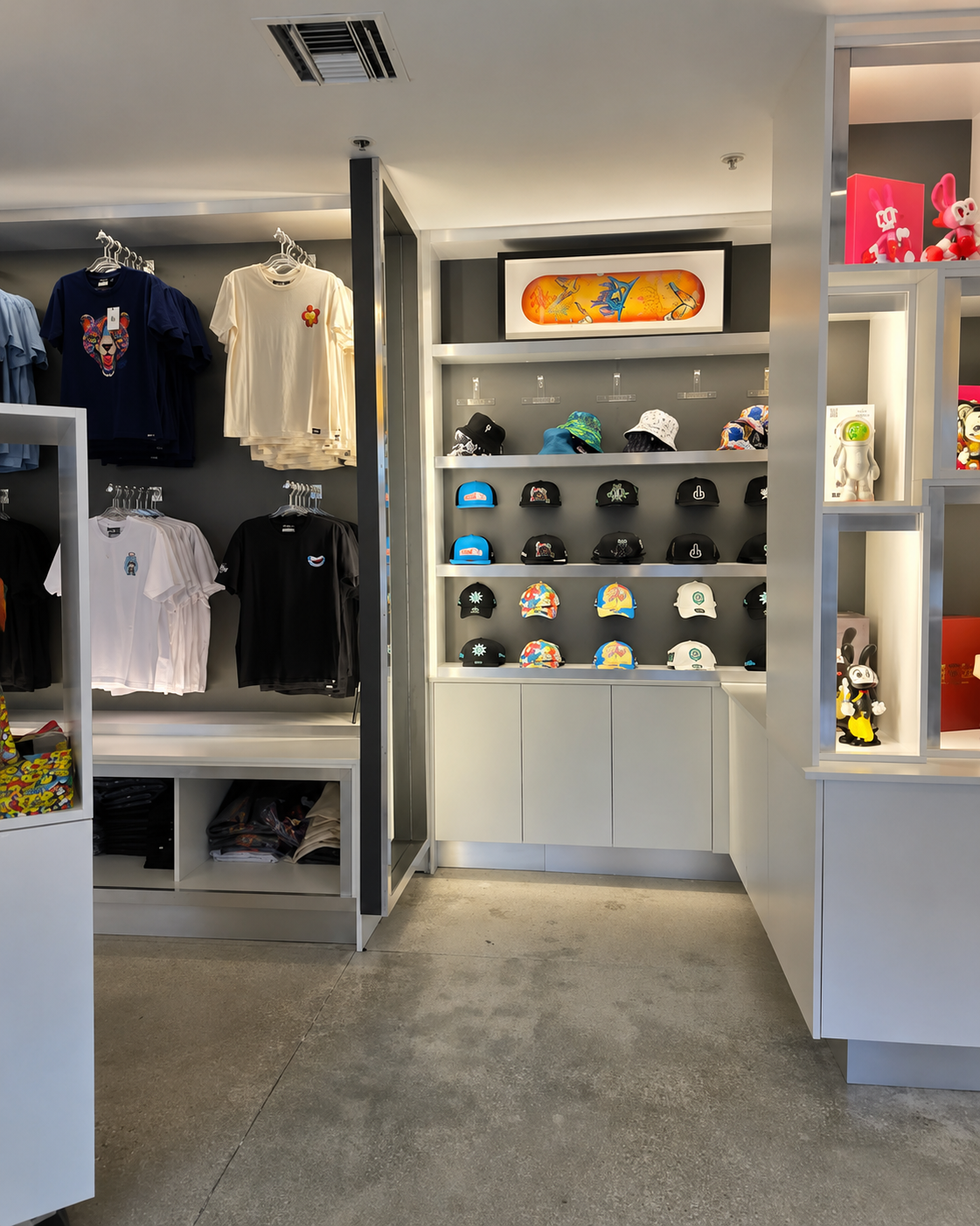 Retail display buildout with illuminated shelves and custom merchandise cabinetry